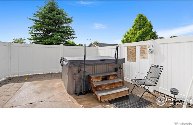 856 Sunchase Dr, Fort Collins, CO 80524 - fenced backyard with a hot tub and a patio