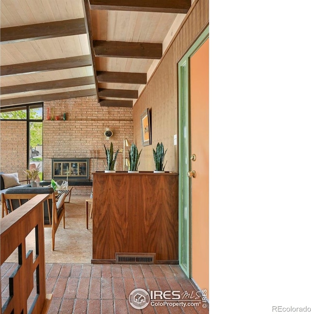 5450 Mohawk Rd, Littleton, CO 80123 - reception area with a brick fireplace and brick wall