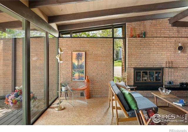 5450 Mohawk Rd, Littleton, CO 80123 - sunroom / solarium featuring an outdoor brick fireplace