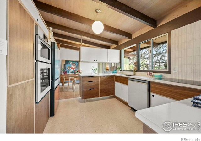 5450 Mohawk Rd, Littleton, CO 80123 - kitchen featuring dishwashing machine, wooden ceiling with exposed beams, a sink, decorative light fixtures, and white cabinets