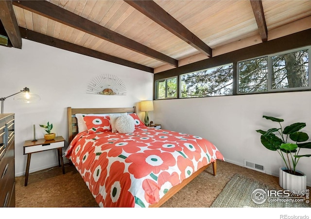 5450 Mohawk Rd, Littleton, CO 80123 - carpeted bedroom featuring wood ceiling with exposed beams and baseboards