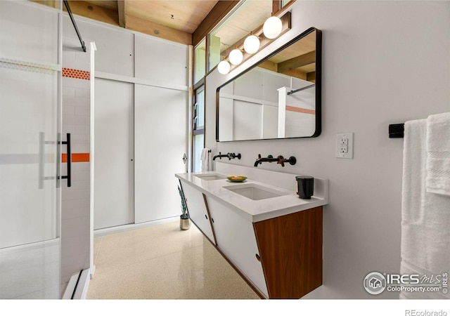 5450 Mohawk Rd, Littleton, CO 80123 - full bath featuring double vanity and a shower with door