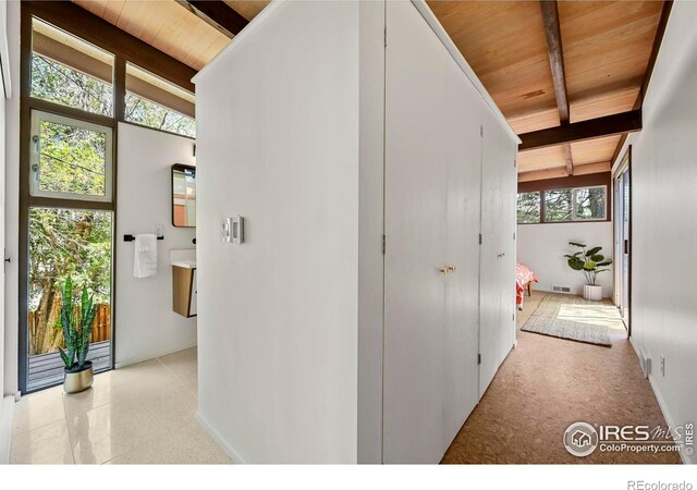 5450 Mohawk Rd, Littleton, CO 80123 - corridor with wood ceiling with exposed beams