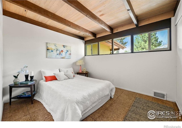 5450 Mohawk Rd, Littleton, CO 80123 - bedroom featuring wooden ceiling with exposed beams and baseboards