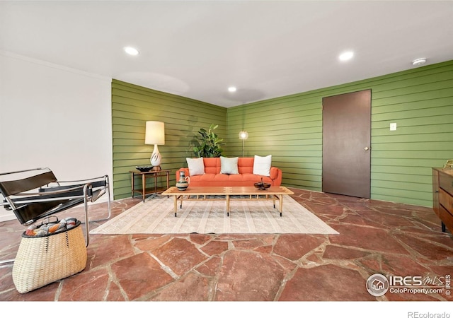 5450 Mohawk Rd, Littleton, CO 80123 - living room with stone flooring, recessed lighting, wood walls, and crown molding
