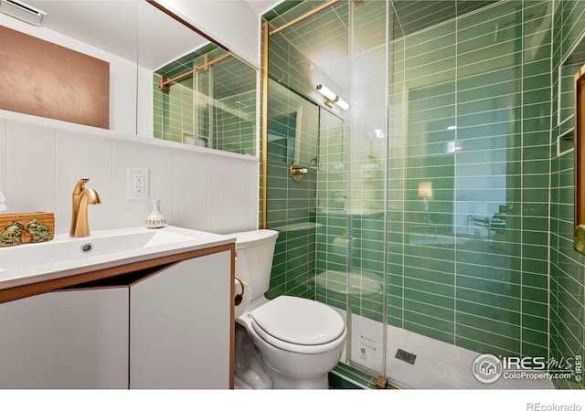 5450 Mohawk Rd, Littleton, CO 80123 - full bathroom featuring toilet, vanity, and a shower stall