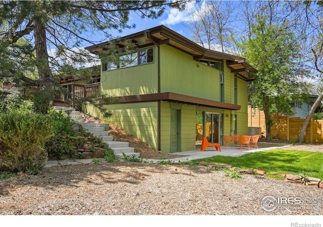 5450 Mohawk Rd, Littleton, CO 80123 - rear view of house with a patio and stairway