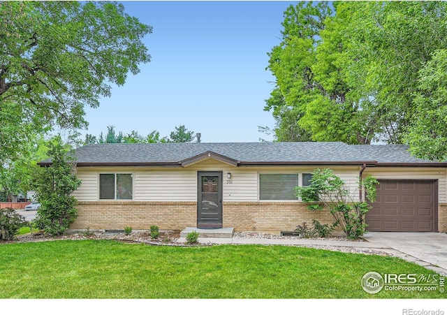 701 Elm St, Windsor, CO 80550 - single story home featuring brick siding, a garage, a front yard, concrete driveway, and roof with shingles