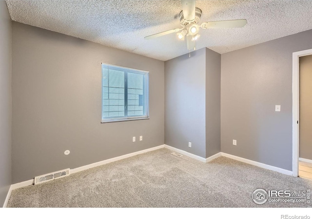 701 Elm St, Windsor, CO 80550 - carpeted spare room featuring ceiling fan, a textured ceiling, and baseboards
