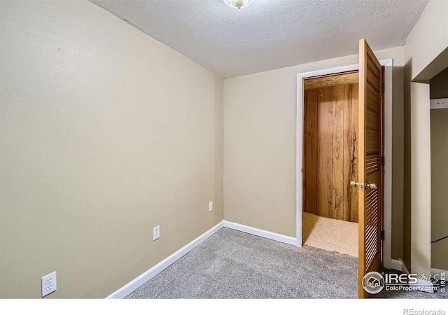 701 Elm St, Windsor, CO 80550 - spare room featuring carpet floors, a textured ceiling, and baseboards