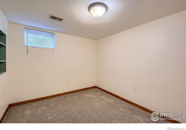 701 Elm St, Windsor, CO 80550 - carpeted spare room featuring baseboards