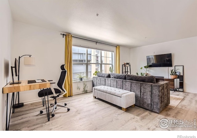 1623 Saint Paul St Unit 310, Denver, CO 80206 - living room featuring light wood-type flooring and an office area