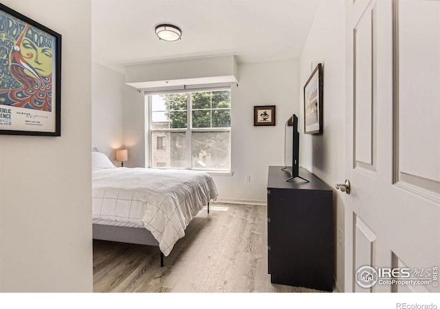 1623 Saint Paul St Unit 310, Denver, CO 80206 - bedroom with wood finished floors and baseboards