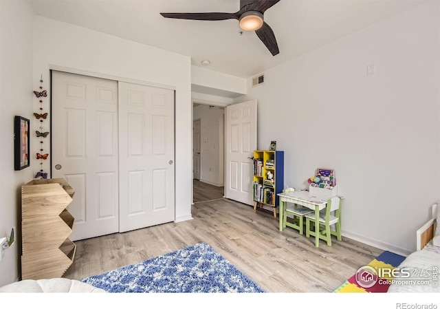 1623 Saint Paul St Unit 310, Denver, CO 80206 - bedroom with a closet, wood finished floors, ceiling fan, and baseboards