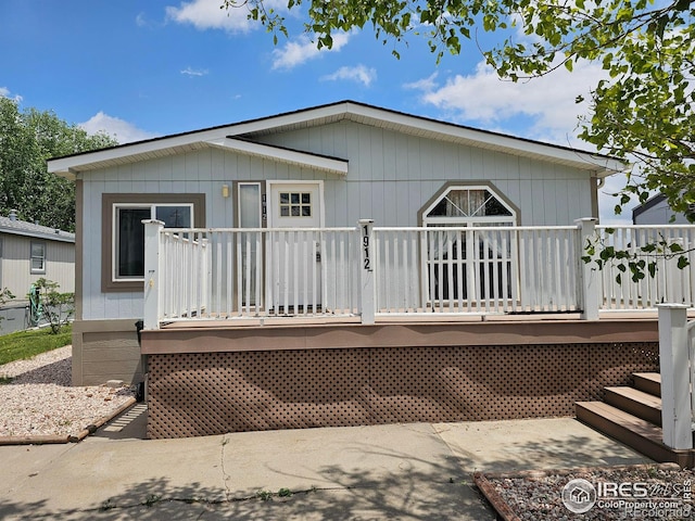 1912 Fillmore St, Sterling, CO 80751 - rear view of house featuring a wooden deck and stairway
