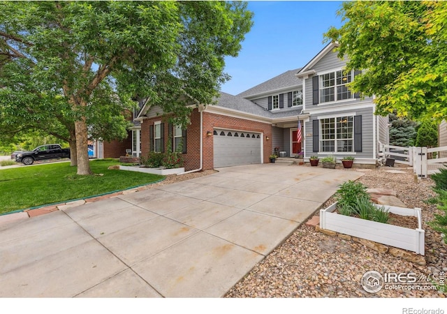 1706 Naples Ln, Longmont, CO 80503 - traditional-style house with an attached garage, driveway, brick siding, and a shingled roof