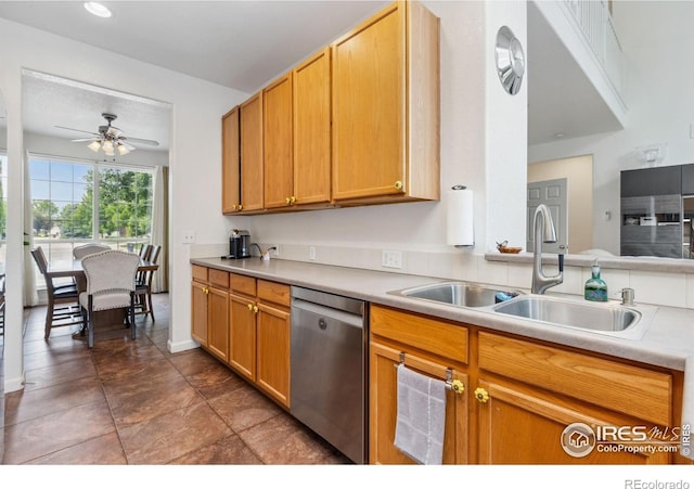 1706 Naples Ln, Longmont, CO 80503 - kitchen with dishwasher, a sink, ceiling fan, light countertops, and baseboards