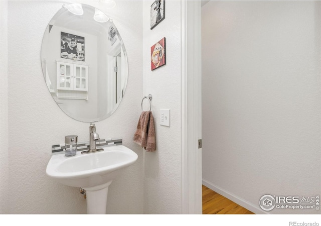 1706 Naples Ln, Longmont, CO 80503 - bathroom featuring wood finished floors and baseboards