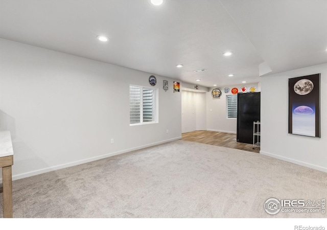 1706 Naples Ln, Longmont, CO 80503 - unfurnished living room with carpet, recessed lighting, and baseboards