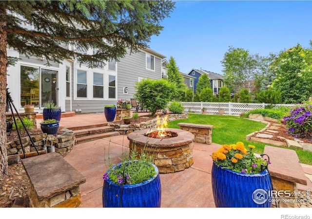 1706 Naples Ln, Longmont, CO 80503 - view of patio / terrace with a fire pit
