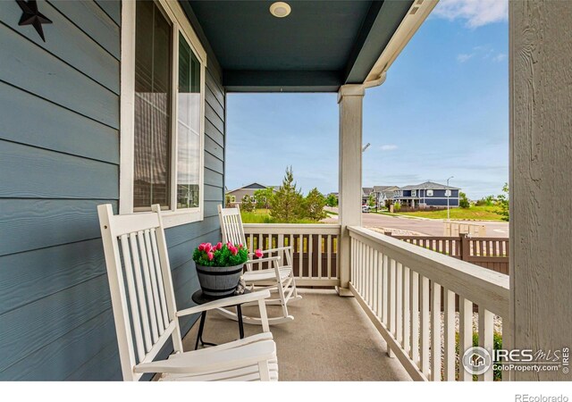 10 N Quantock St, Aurora, CO 80018 - porch featuring a residential view
