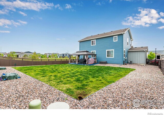 10 N Quantock St, Aurora, CO 80018 - rear view of house featuring a gazebo, a patio area, and central AC