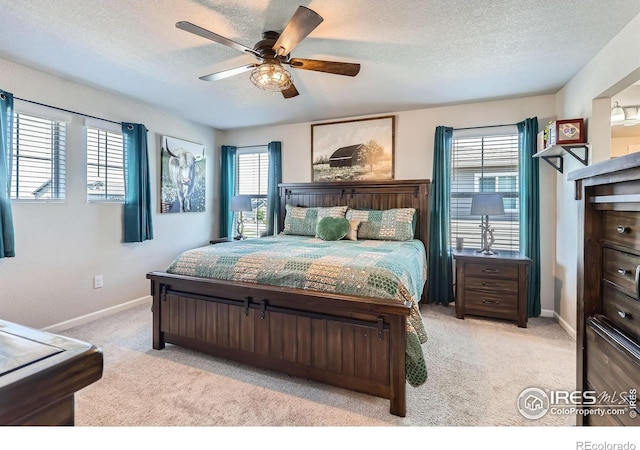 10 N Quantock St, Aurora, CO 80018 - bedroom featuring light carpet, a textured ceiling, and a ceiling fan