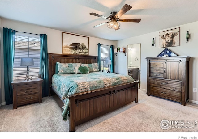 10 N Quantock St, Aurora, CO 80018 - bedroom with light carpet, connected bathroom, and a ceiling fan