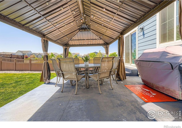 10 N Quantock St, Aurora, CO 80018 - view of patio featuring outdoor dining area and a gazebo