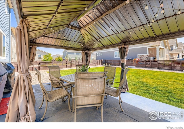 10 N Quantock St, Aurora, CO 80018 - view of patio / terrace with outdoor dining space and a gazebo