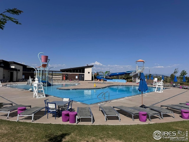 10 N Quantock St, Aurora, CO 80018 - community pool featuring a water slide and a patio