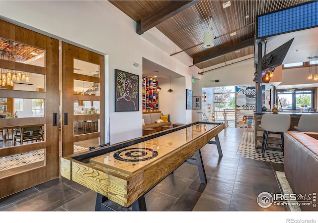 10 N Quantock St, Aurora, CO 80018 - rec room featuring high vaulted ceiling, a wooden ceiling with exposed beams, and healthy amount of natural light