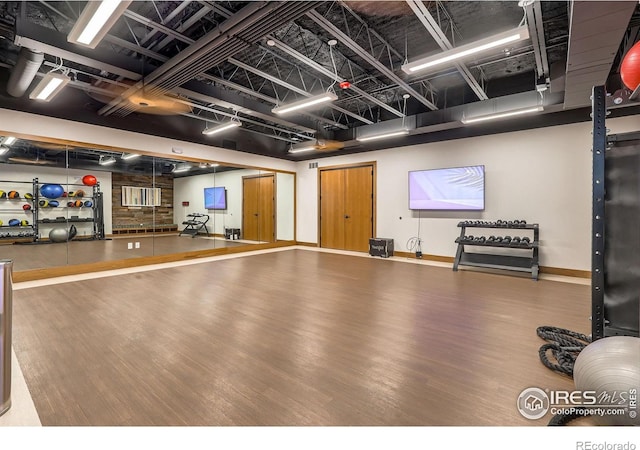 10 N Quantock St, Aurora, CO 80018 - exercise area featuring wood finished floors and baseboards