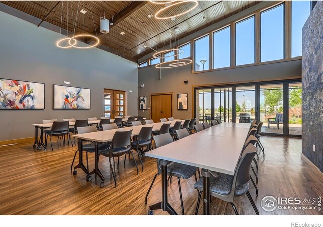 10 N Quantock St, Aurora, CO 80018 - dining room with a towering ceiling, wood finished floors, and wooden ceiling