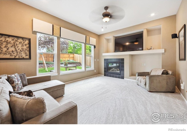 13560 Detroit St, Thornton, CO 80241 - living area featuring carpet floors, a tiled fireplace, ceiling fan, and recessed lighting
