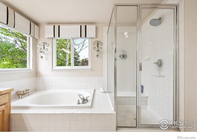 13560 Detroit St, Thornton, CO 80241 - full bath with a bath, a shower stall, and vanity
