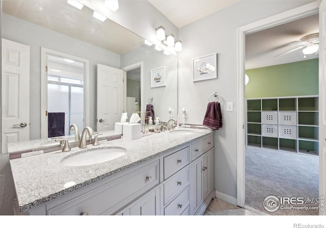 13560 Detroit St, Thornton, CO 80241 - bathroom with double vanity and ceiling fan