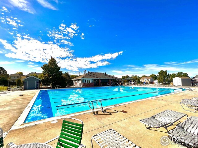 13560 Detroit St, Thornton, CO 80241 - community pool with a storage unit and a patio