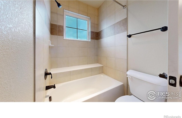 2107 Blackbird Dr, Fort Collins, CO 80525 - bathroom featuring bathing tub / shower combination and a textured wall