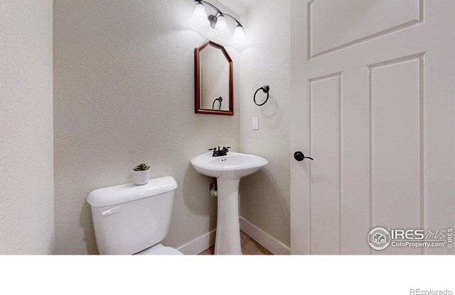 2107 Blackbird Dr, Fort Collins, CO 80525 - bathroom with toilet and a sink