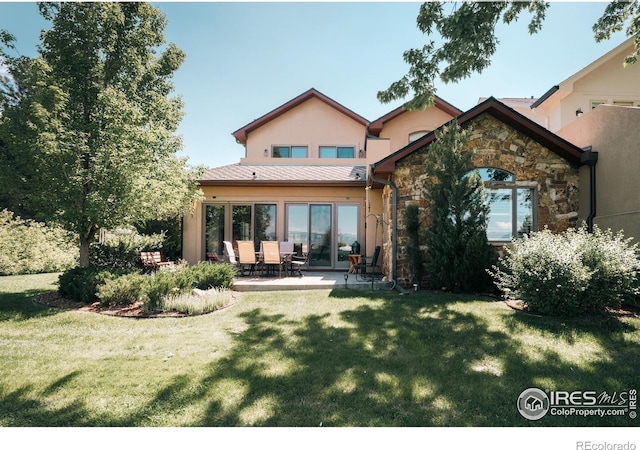 4993 Clubhouse Ct, Boulder, CO 80301 - back of house featuring stone siding, a yard, a patio, and stucco siding