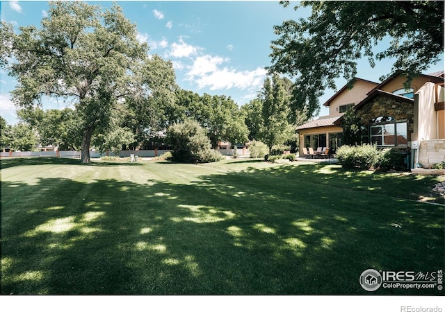 4993 Clubhouse Ct, Boulder, CO 80301 - view of grassy yard featuring a patio