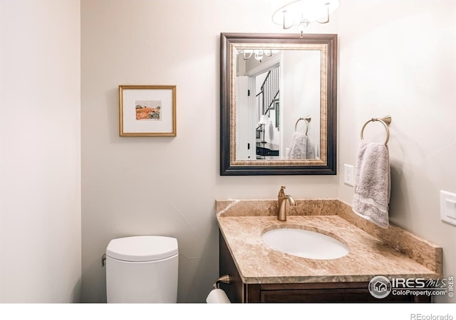 4993 Clubhouse Ct, Boulder, CO 80301 - half bathroom featuring vanity and toilet