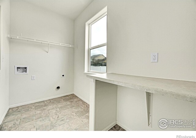 1711 101st Avenue Ct, Greeley, CO 80634 - laundry room featuring washer hookup, electric dryer hookup, and baseboards