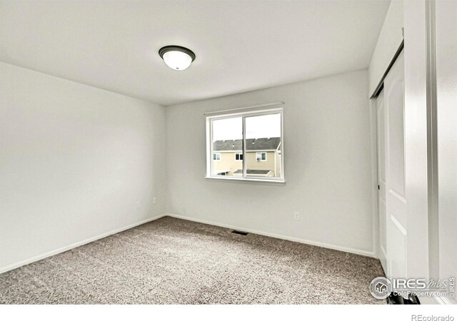 1711 101st Avenue Ct, Greeley, CO 80634 - unfurnished bedroom featuring carpet, a closet, and baseboards
