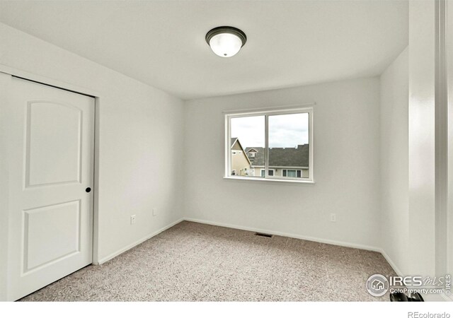 1711 101st Avenue Ct, Greeley, CO 80634 - unfurnished room featuring carpet flooring and baseboards