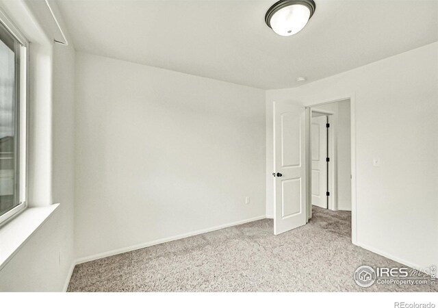 1711 101st Avenue Ct, Greeley, CO 80634 - carpeted spare room with baseboards