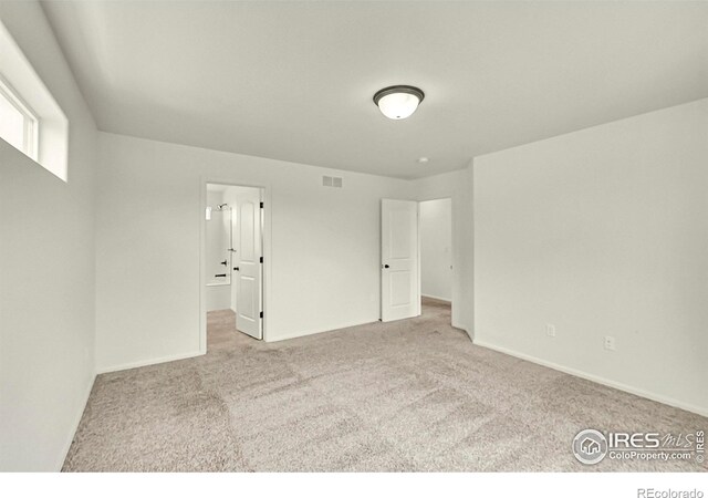 1711 101st Avenue Ct, Greeley, CO 80634 - carpeted spare room featuring baseboards
