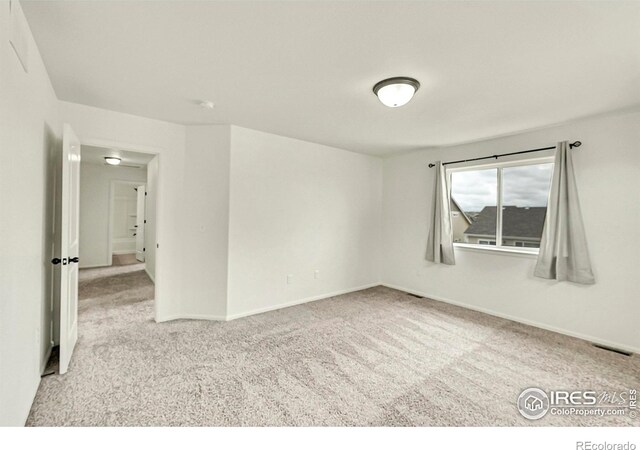 1711 101st Avenue Ct, Greeley, CO 80634 - empty room with carpet and baseboards