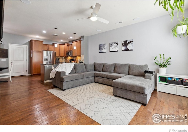 16031 W 63rd Ln W Unit D, Arvada, CO 80403 - living area featuring dark wood-style floors, recessed lighting, and ceiling fan